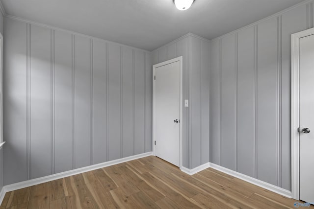 spare room with wood-type flooring