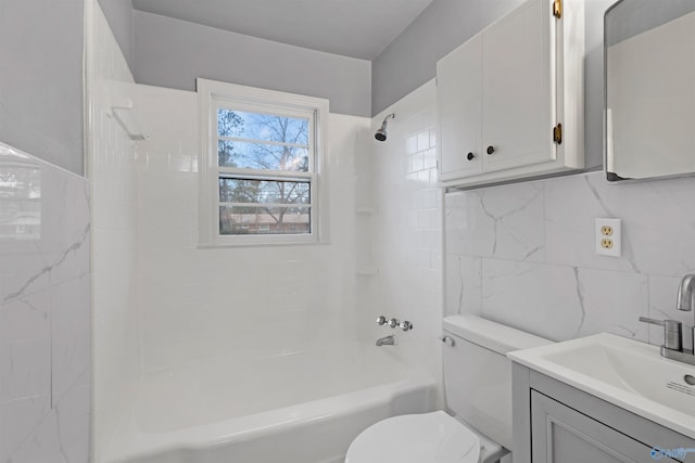 full bathroom with decorative backsplash, vanity, tiled shower / bath combo, tile walls, and toilet