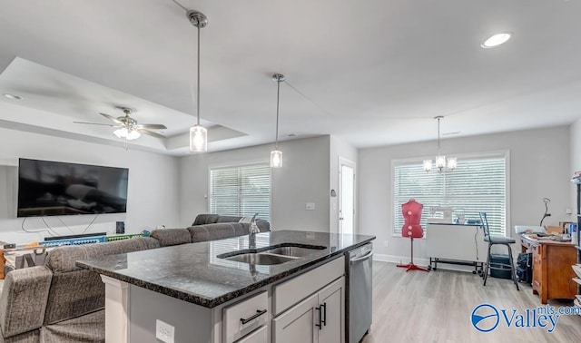 193 Cherry Laurel Dr, Hazel Green, AL 35750 - kitchen with a sink, stainless steel dishwasher, dark stone counters, light wood-type flooring, and open floor plan