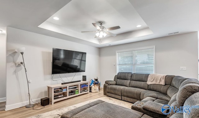 193 Cherry Laurel Dr, Hazel Green, AL 35750 - living area featuring a raised ceiling, wood finished floors, ceiling fan, recessed lighting, and baseboards