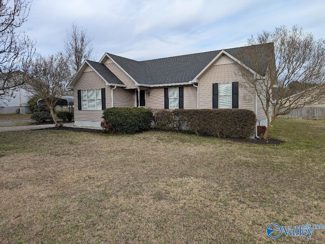 ranch-style house with a front lawn