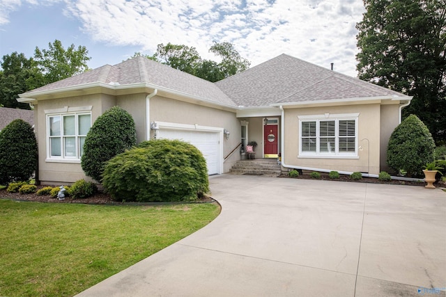 178 Ridgewood Cir, Cherokee Ridge, AL 35175 - view of front facade with roof with shingles, a garage, stucco siding, driveway, and a front yard