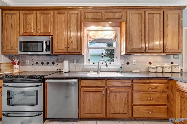 178 Ridgewood Cir, Cherokee Ridge, AL 35175 - kitchen with stainless steel appliances, a sink, brown cabinets, and backsplash