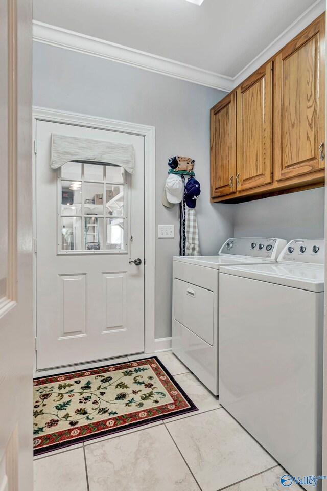 178 Ridgewood Cir, Cherokee Ridge, AL 35175 - laundry room featuring cabinet space, crown molding, washer and clothes dryer, and light tile patterned flooring
