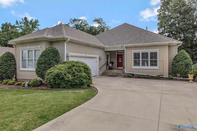 178 Ridgewood Cir, Cherokee Ridge, AL 35175 - view of front of home featuring stucco siding, a shingled roof, an attached garage, and concrete driveway