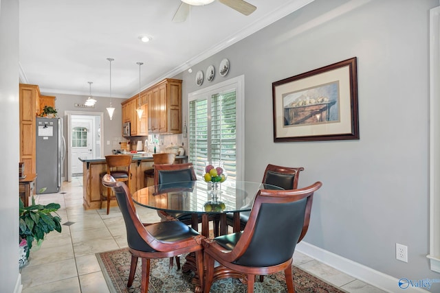 178 Ridgewood Cir, Cherokee Ridge, AL 35175 - dining room with light tile patterned flooring, crown molding, ceiling fan, and baseboards