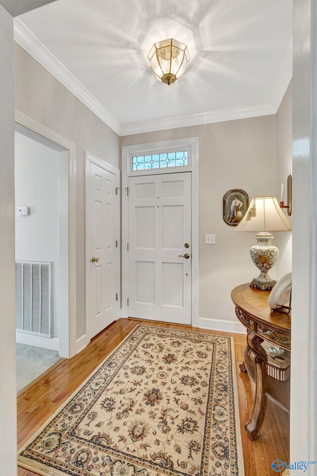 178 Ridgewood Cir, Cherokee Ridge, AL 35175 - entryway with wood finished floors, crown molding, and baseboards
