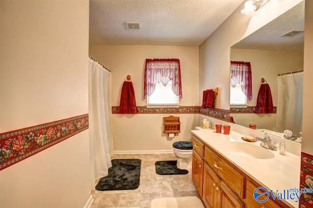 25000 Union Hill Rd, Ardmore, TN 38449 - full bathroom with vanity, visible vents, toilet, a textured ceiling, and a wealth of natural light