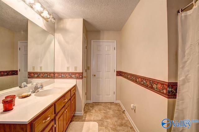 25000 Union Hill Rd, Ardmore, TN 38449 - full bath with vanity, baseboards, and a textured ceiling