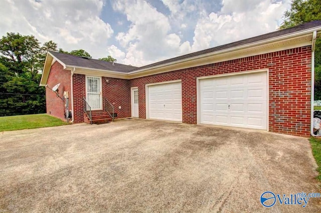25000 Union Hill Rd, Ardmore, TN 38449 - ranch-style house featuring entry steps, an attached garage, driveway, and brick siding