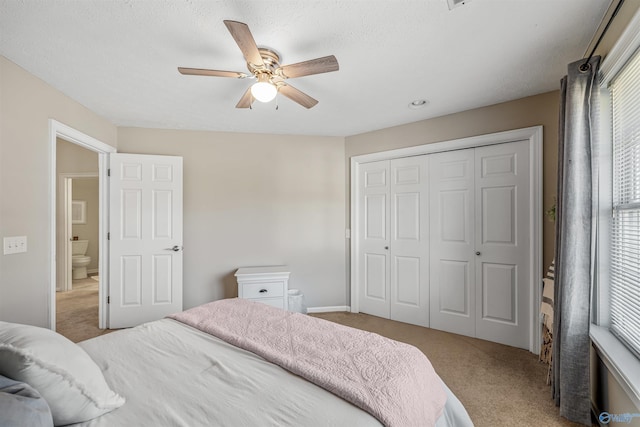 bedroom featuring carpet floors, a closet, and a ceiling fan