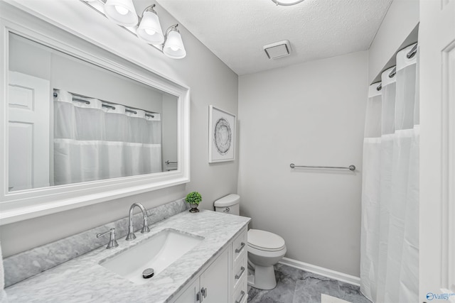 bathroom with visible vents, toilet, a textured ceiling, vanity, and baseboards