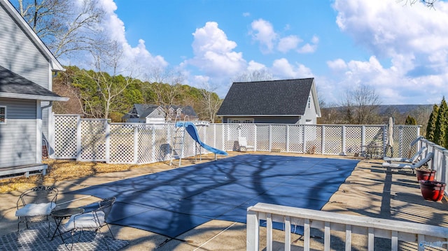 view of pool featuring fence