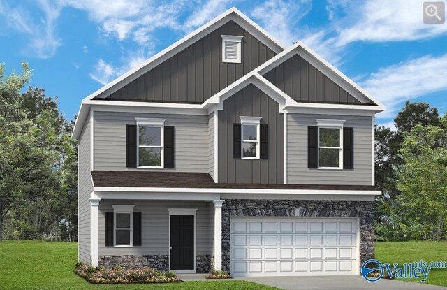 craftsman house featuring a garage and a front lawn