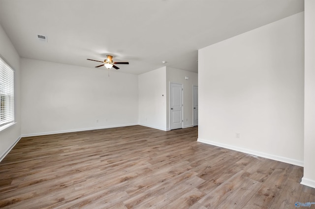 spare room featuring ceiling fan and light hardwood / wood-style floors