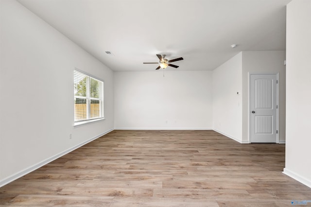 spare room featuring ceiling fan and light wood-type flooring