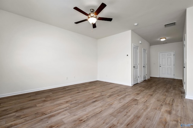 unfurnished room with ceiling fan and light hardwood / wood-style flooring