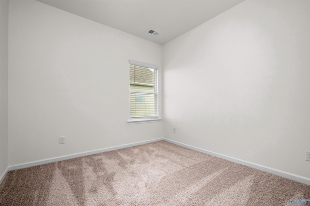 unfurnished room featuring carpet flooring