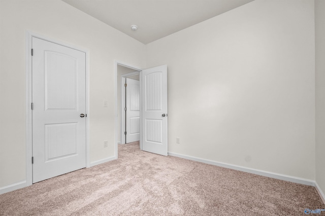 unfurnished bedroom with light carpet