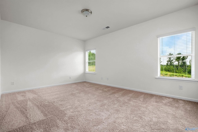 unfurnished room with carpet floors