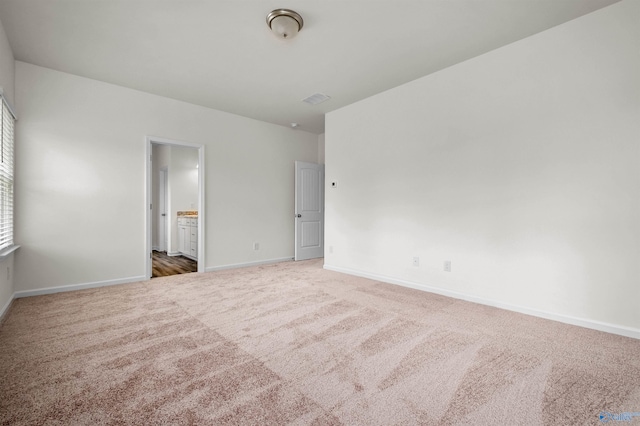 unfurnished room featuring carpet