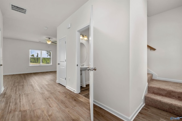 hallway featuring light hardwood / wood-style flooring