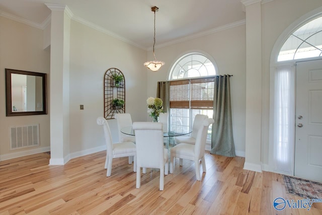 227 Lee Bowden Dr, Huntsville, AL 35806 - dining area featuring light wood finished floors, ornamental molding, and baseboards