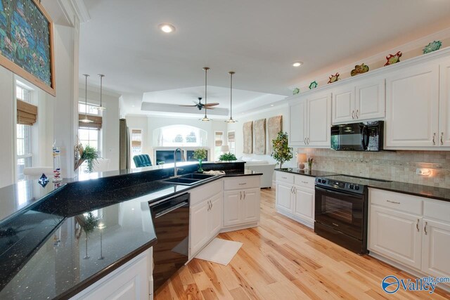 227 Lee Bowden Dr, Huntsville, AL 35806 - kitchen featuring black appliances, a sink, light wood-type flooring, ceiling fan, and white cabinetry