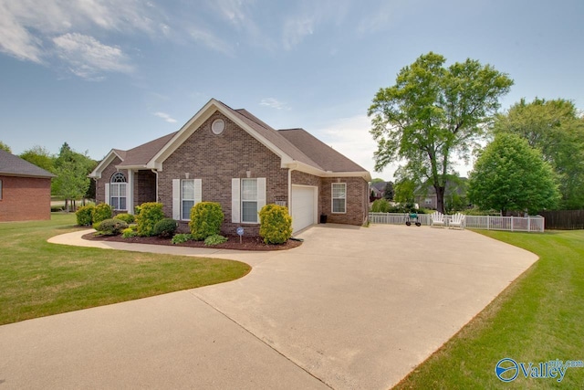 227 Lee Bowden Dr, Huntsville, AL 35806 - view of front of property with a garage, driveway, and brick siding