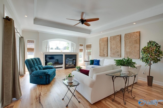 227 Lee Bowden Dr, Huntsville, AL 35806 - living area featuring a raised ceiling, ceiling fan, light wood finished floors, recessed lighting, and crown molding