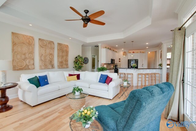 227 Lee Bowden Dr, Huntsville, AL 35806 - living room with ceiling fan, ornamental molding, light wood-style floors, recessed lighting, and a tray ceiling