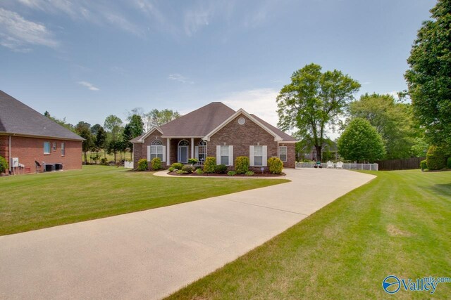227 Lee Bowden Dr, Huntsville, AL 35806 - view of front of house with brick siding and central air condition unit