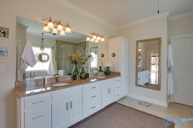 227 Lee Bowden Dr, Huntsville, AL 35806 - full bathroom featuring a stall shower, vanity, ornamental molding, tile patterned flooring, and baseboards