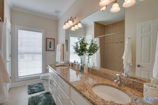 227 Lee Bowden Dr, Huntsville, AL 35806 - bathroom with tile patterned floors, a tile shower, crown molding, double vanity, and toilet