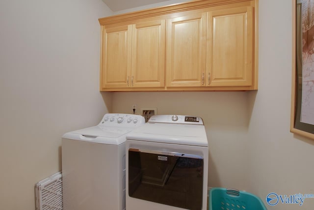 227 Lee Bowden Dr, Huntsville, AL 35806 - laundry area with washer and dryer and cabinet space