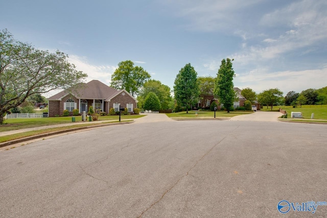 227 Lee Bowden Dr, Huntsville, AL 35806 - view of asphalt road featuring sidewalks and curbs