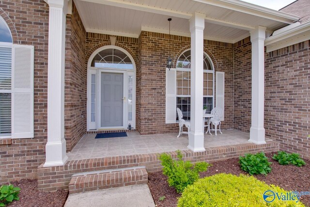 227 Lee Bowden Dr, Huntsville, AL 35806 - entrance to property featuring covered porch and brick siding