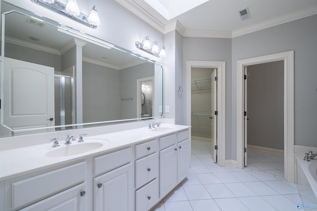 bathroom featuring tile patterned flooring, visible vents, ornamental molding, and a sink