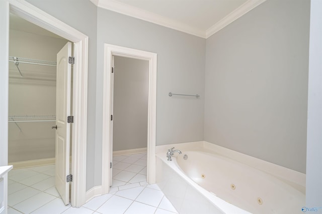 bathroom with tile patterned flooring, a spacious closet, baseboards, a whirlpool tub, and ornamental molding