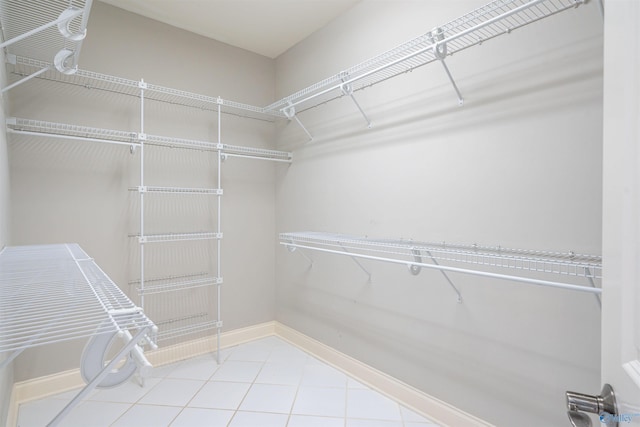 spacious closet with tile patterned flooring