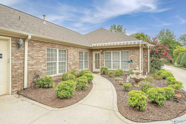 doorway to property with a garage