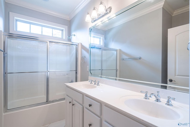 full bathroom featuring a sink, enclosed tub / shower combo, double vanity, and crown molding