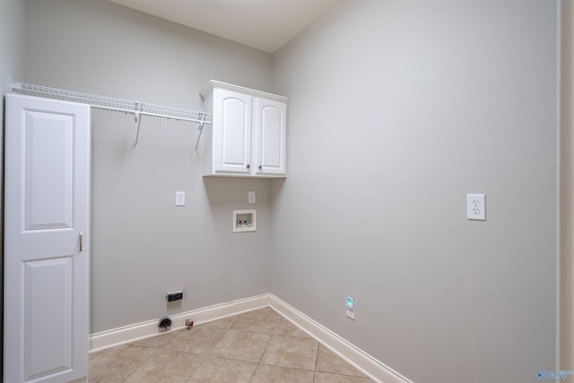 laundry room with baseboards, gas dryer hookup, washer hookup, light tile patterned floors, and cabinet space