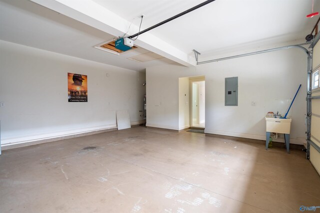 garage with electric panel, a garage door opener, and baseboards