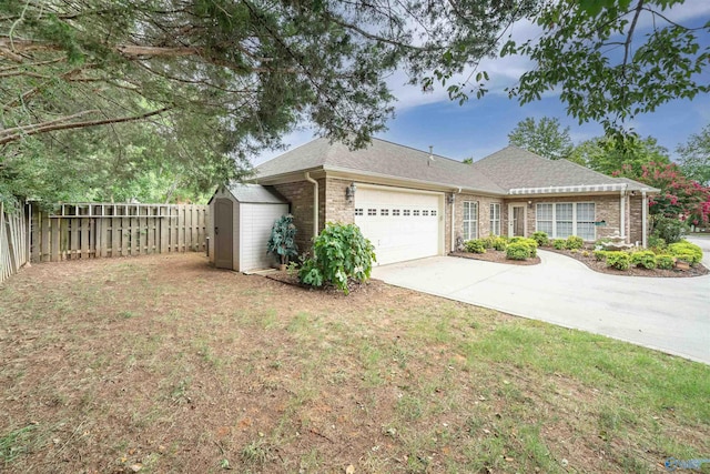 single story home with fence, driveway, a garage, a storage shed, and brick siding