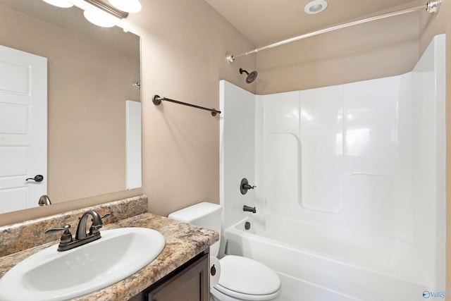 full bath featuring shower / bathing tub combination, vanity, and toilet