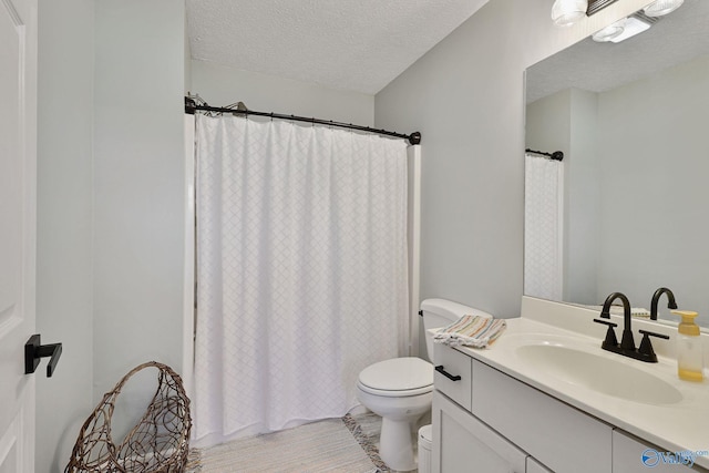 bathroom with toilet, vanity, a shower with curtain, wood finished floors, and a textured ceiling