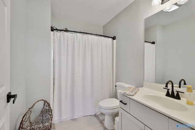 bathroom with toilet, a textured ceiling, vanity, and a shower with curtain