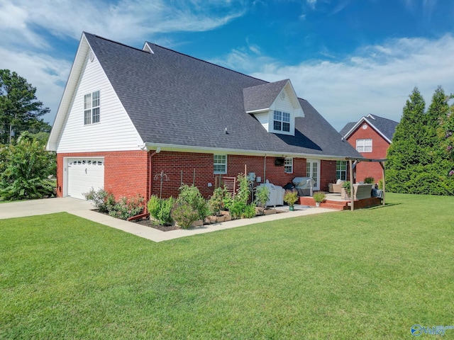 exterior space with concrete driveway, an attached garage, a front yard, a wooden deck, and brick siding