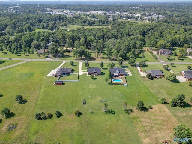 bird's eye view featuring a wooded view